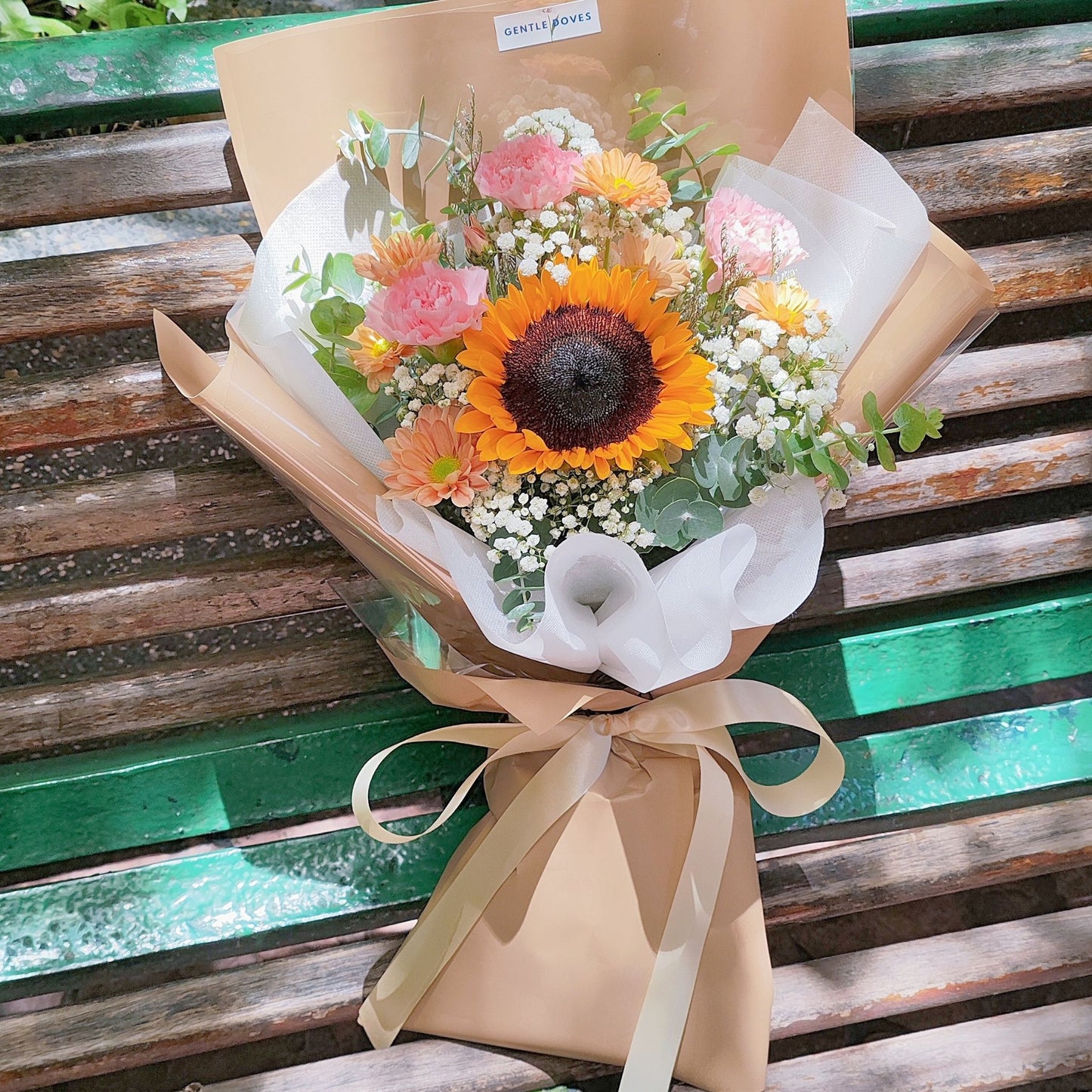 Single Sunflower with Pink and Orange Flowers in Brown Paper Bouquet