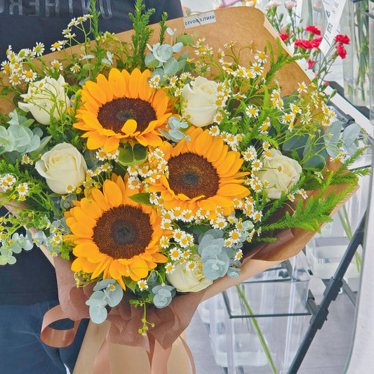 Three Sunflowers with Daisies and White Roses in Kraft Paper Bouquet