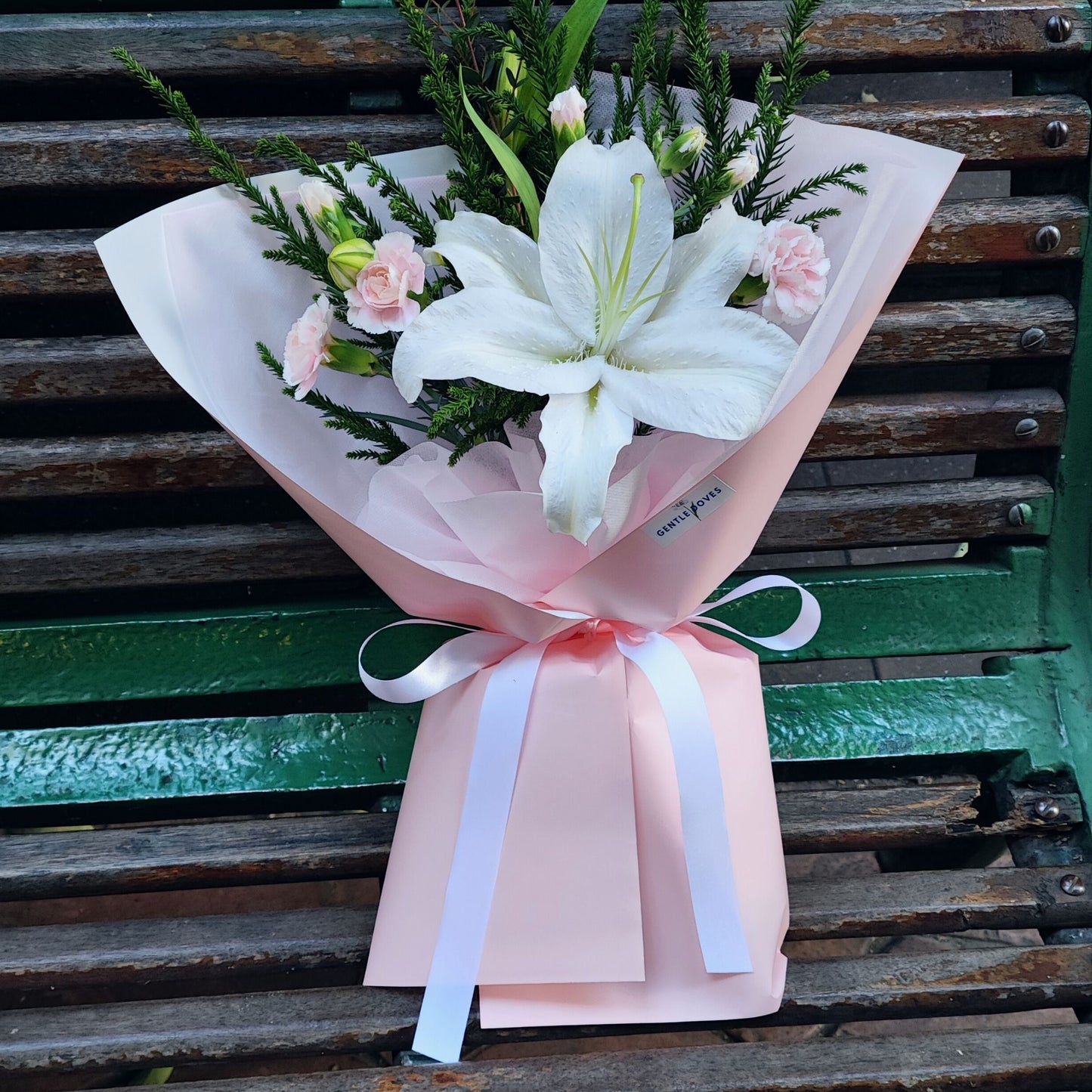 Single White Lily with Pink Filler Flowers and Sugi Pines Boquet