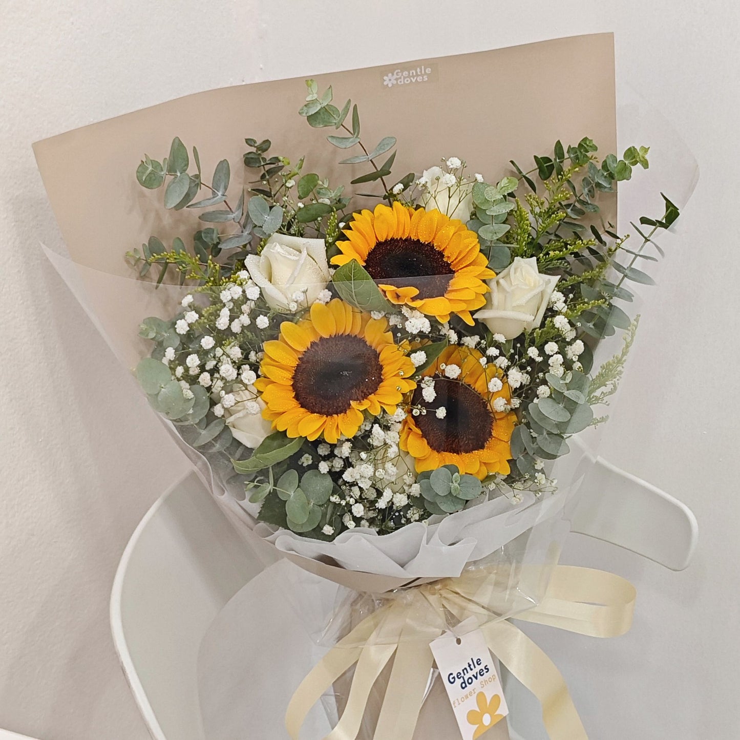 Three Sunflowers with Five White Roses and Foliage Bouquet