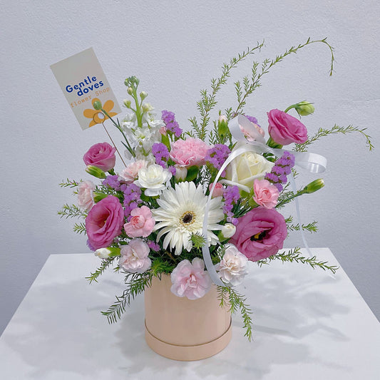 Assorted Pink and Green Foliage in Small Box Arrangement