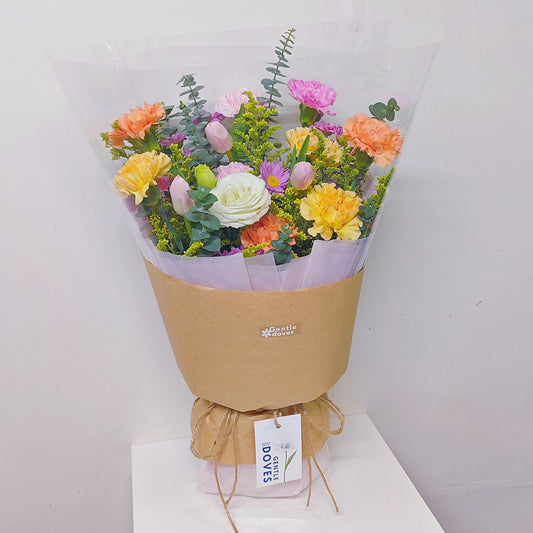 Assorted Flowers in Yellow, Pink and Orange with Pink Tulips Minimal Style Bouquet