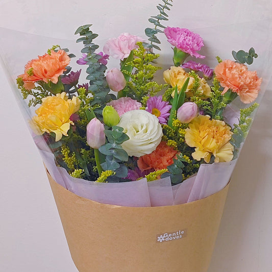 Assorted Flowers in Yellow, Pink and Orange with Pink Tulips Minimal Style Bouquet