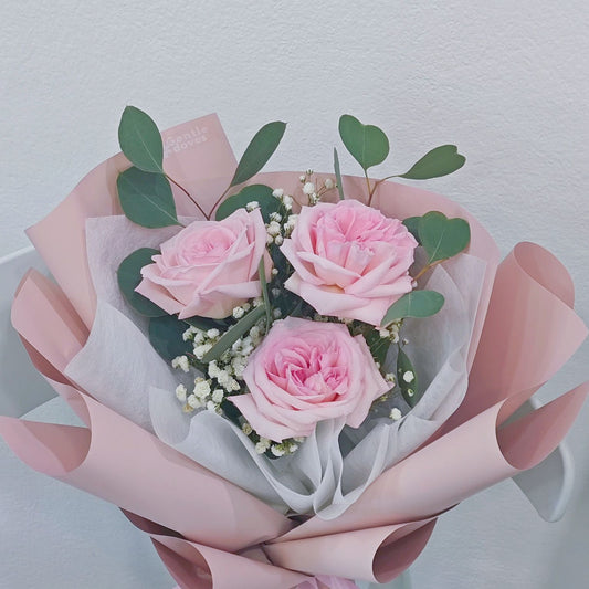 Three Soft Pink English Roses with Gypsophila and Eucalyptus in Soft Pink Paper Bouquet