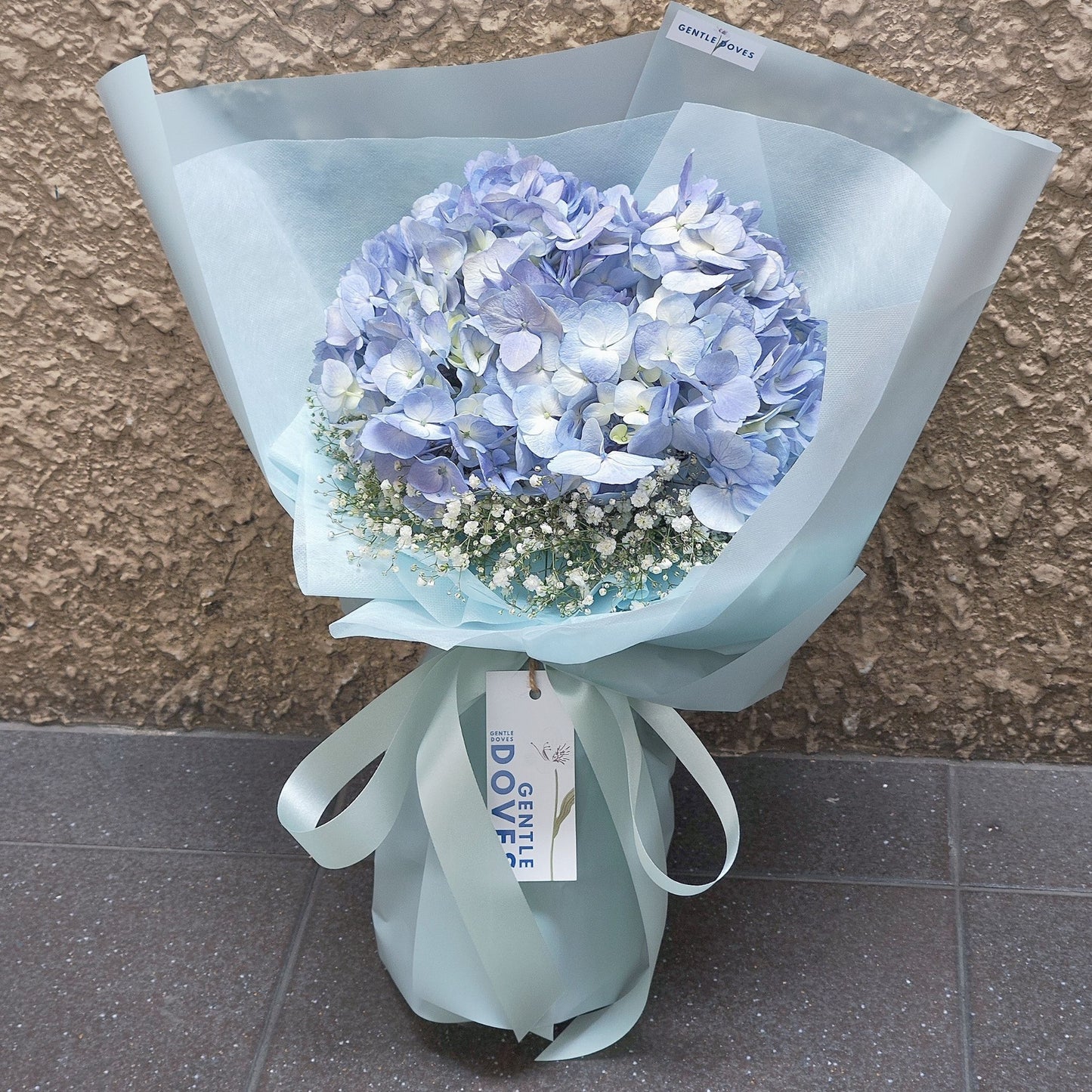 Single Blue Hydrangea Surrounded with Gypsophila Below Bouquet