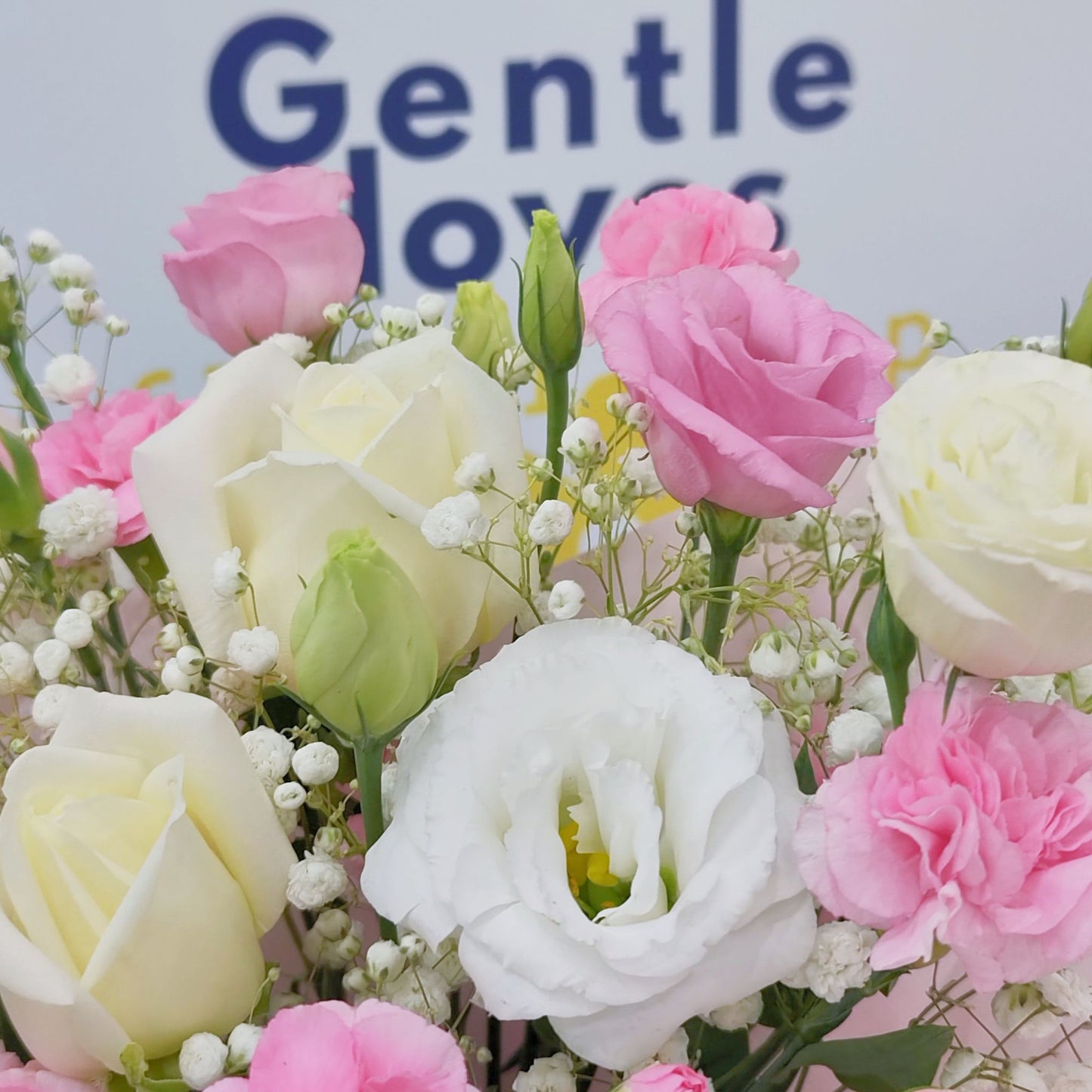 Assorted Pink Sprayed Carnations, lisianthus and White Roses in Small Vase Arrangement
