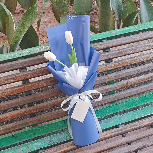 Two White Tulips in Blue Paper Bouquet