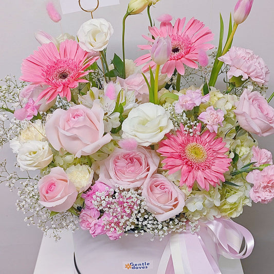 Assorted Pastel Pink and White Flowers in Medium Box Arrangement.