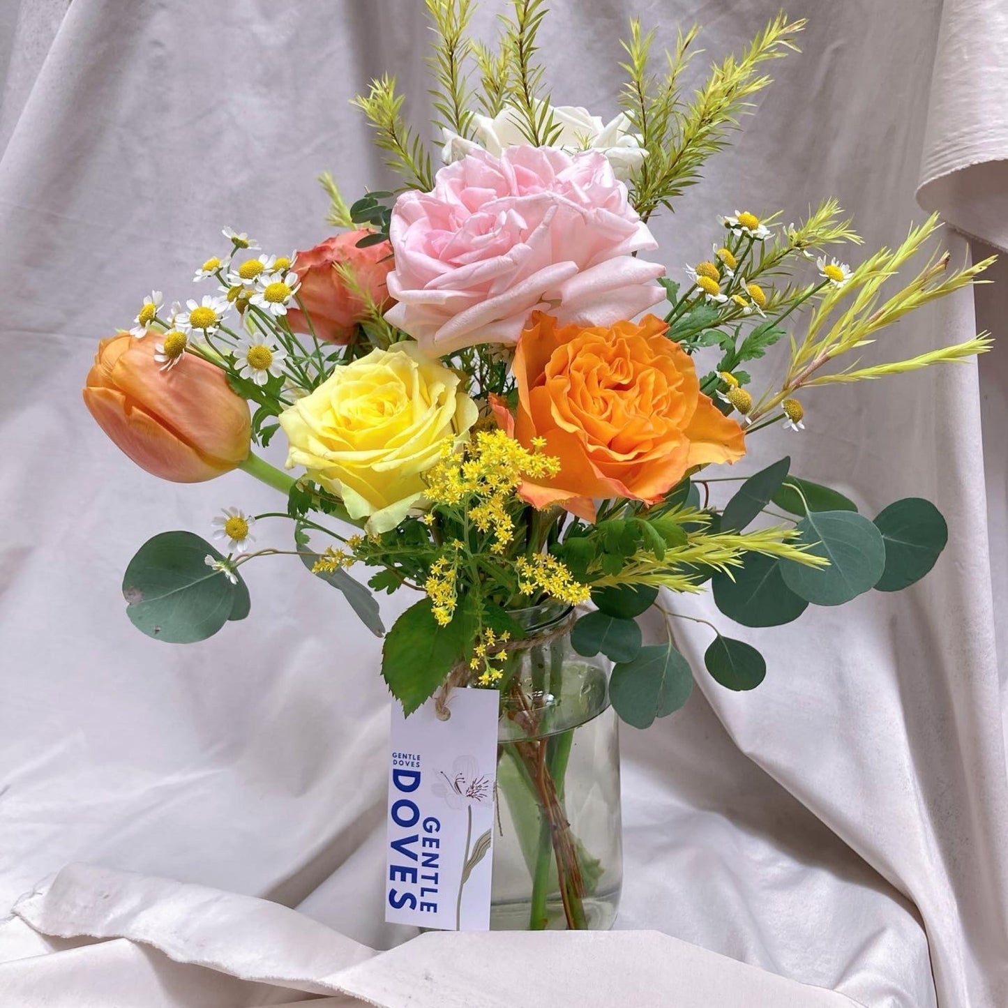 Assorted Colorful Roses with Tulip and Filler Flowers in Medium Vase Arrangement