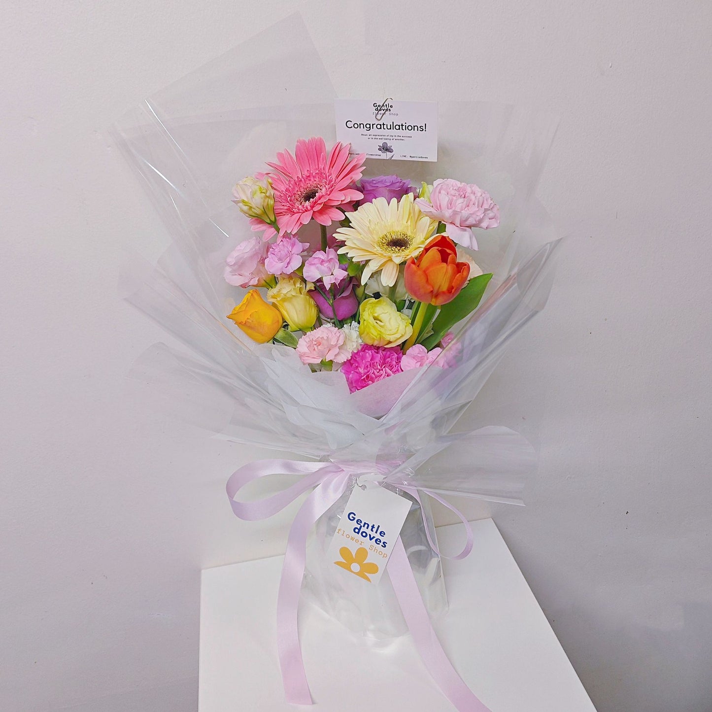 Assorted Coloful Flowers in Pink, White and Orange in Transparent Paper Bouquet