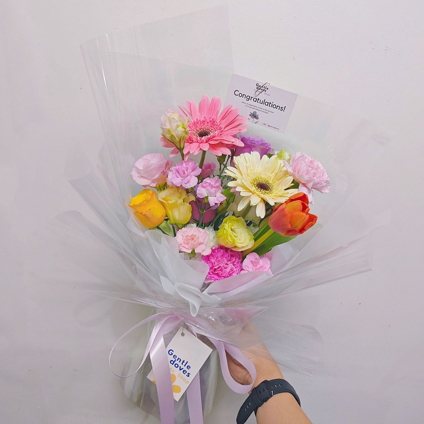 Assorted Coloful Flowers in Pink, White and Orange in Transparent Paper Bouquet