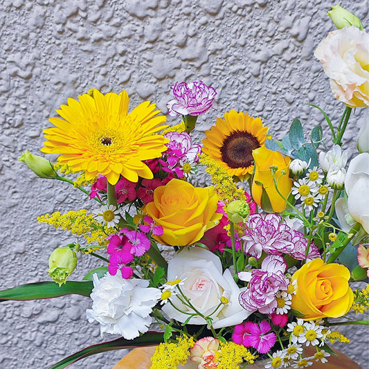 Assorted Yellow and Purple Flowers Small Box Arrangement