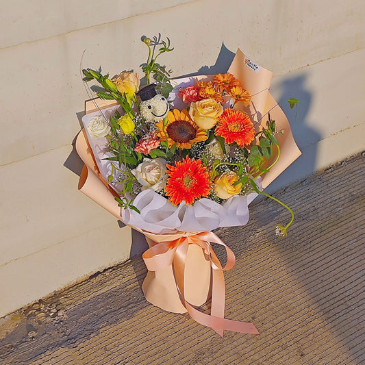 Assorted Orange and Yellow Flowers with Graduated Smiley Face Bouquet