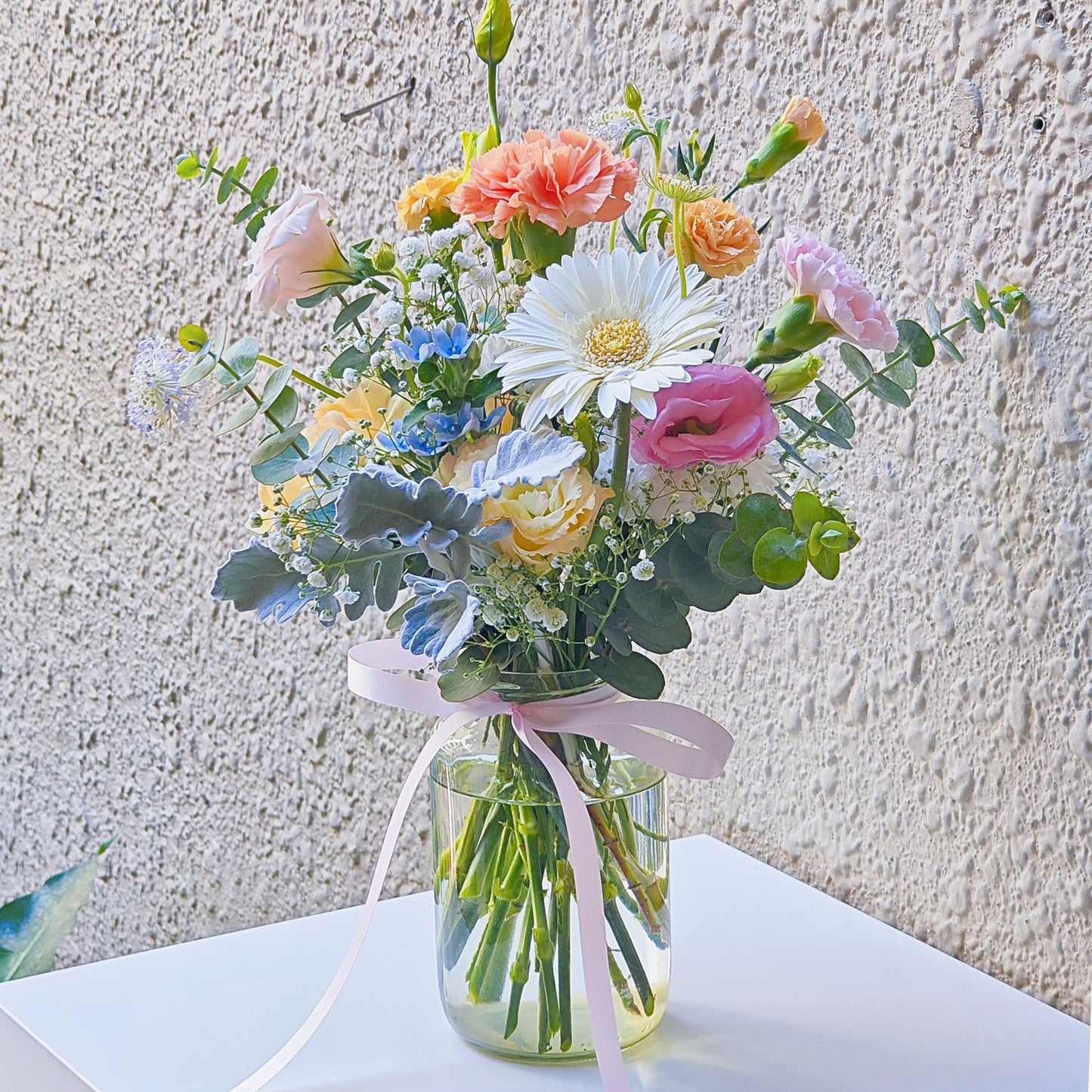 Assorted Soft Tone Flowers and Foliage in Medium Vase Arrangement