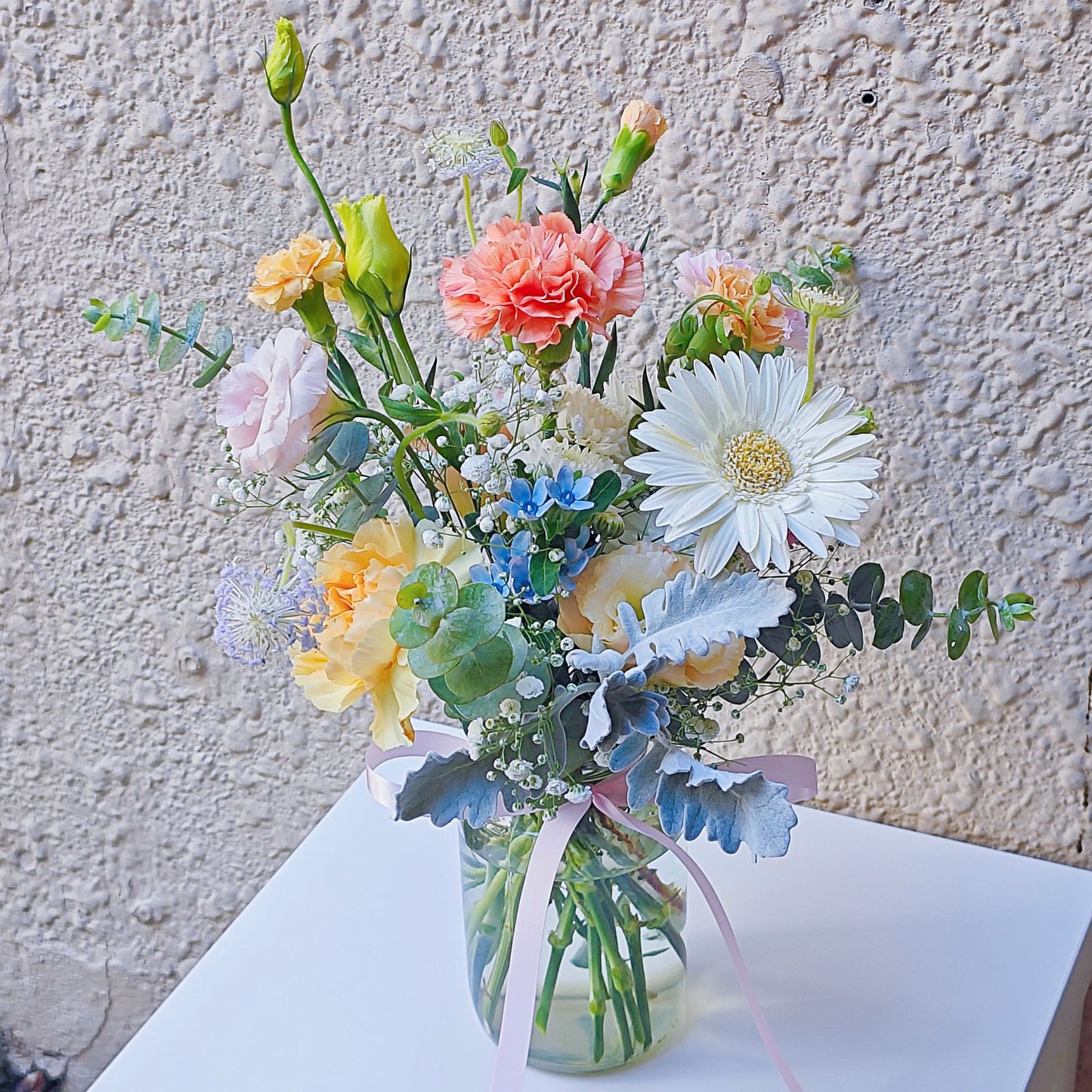 Assorted Soft Tone Flowers and Foliage in Medium Vase Arrangement