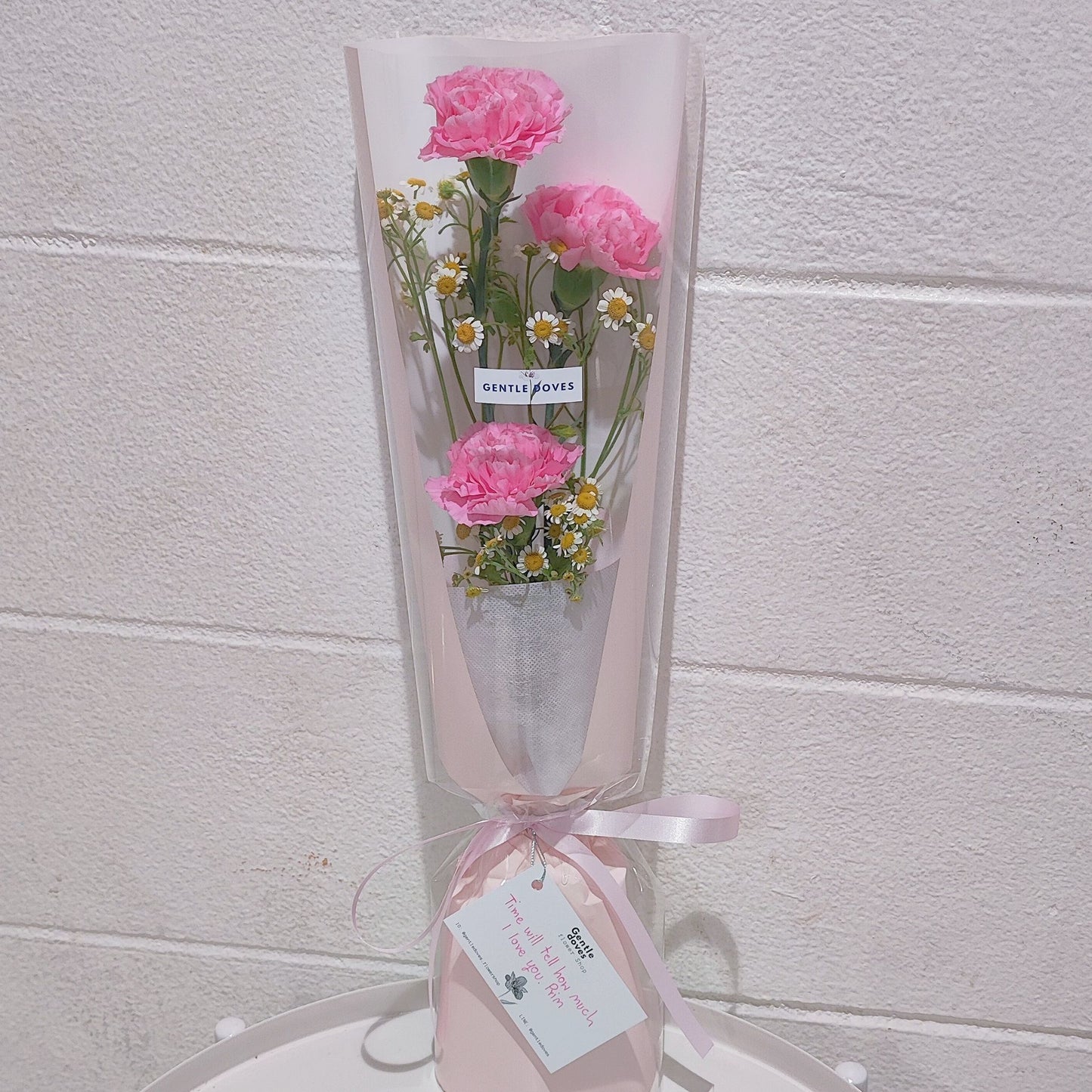 Three Pink Carnations with Daisies in Cylinder Bouquet