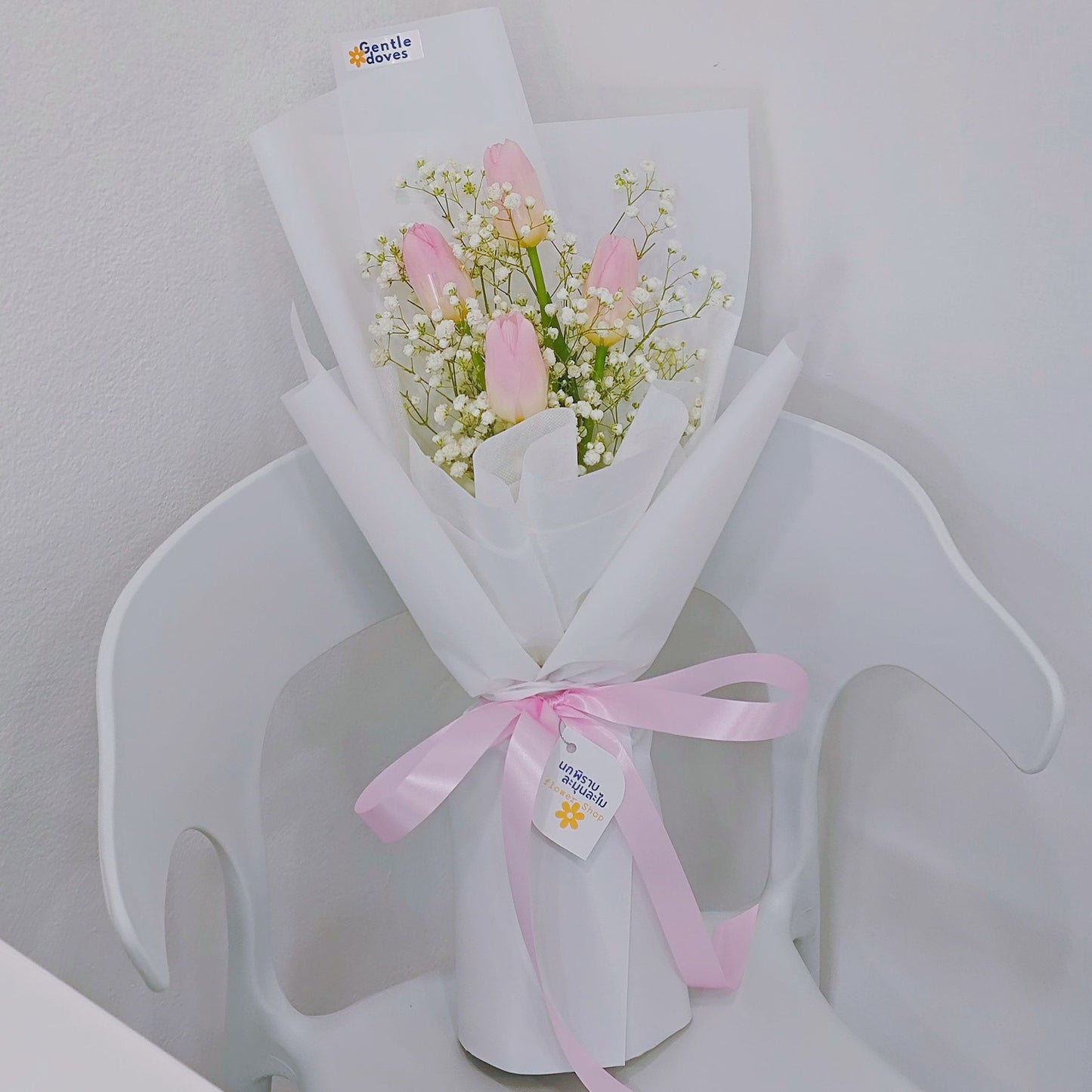 Four Pink Tulips with Gypsophila in White Paper Bouquet