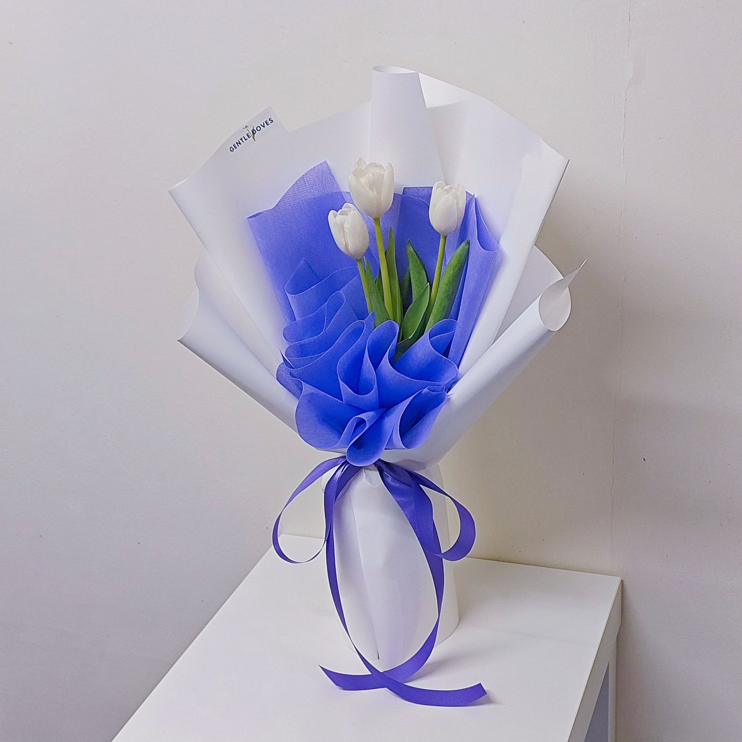 Three White Tulips in Vivid Purple and White Paper Bouquet
