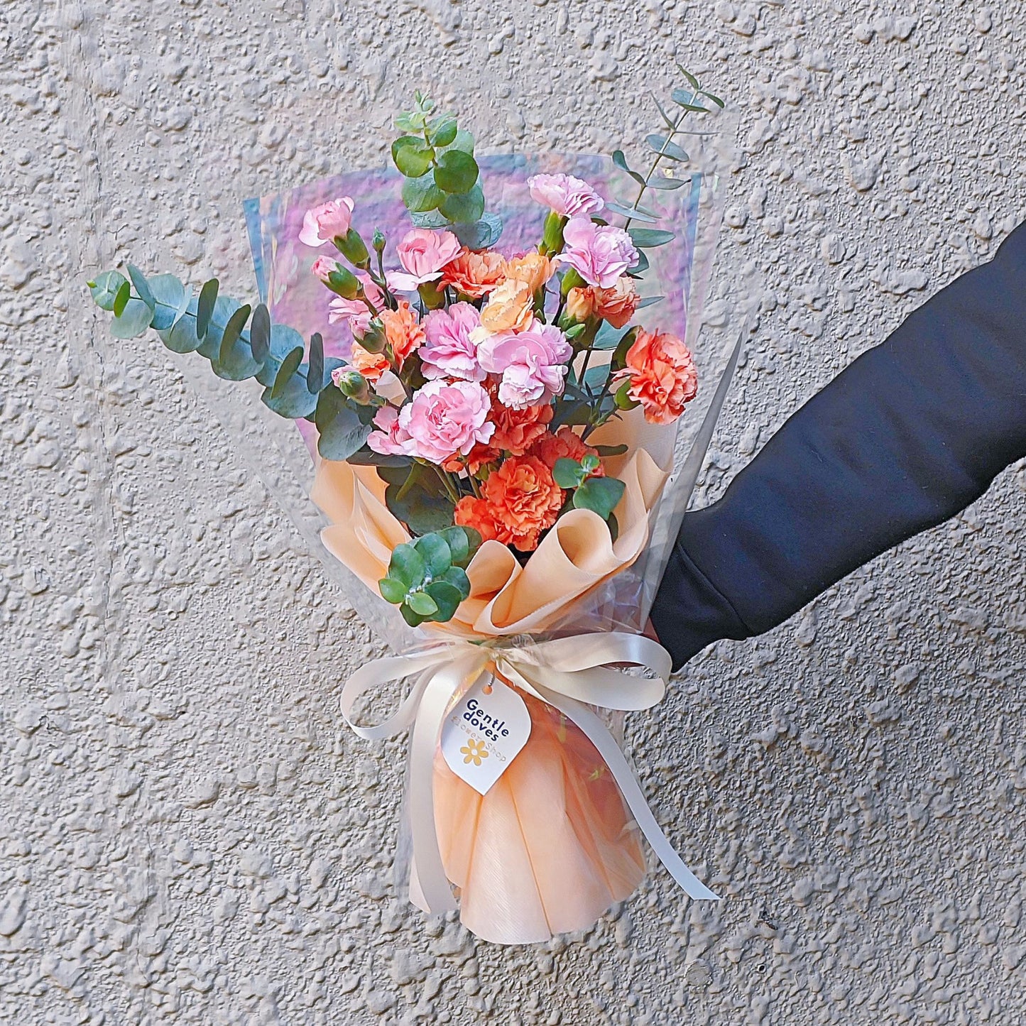 Assorted Orange and Pink Sprayed Carnations with Eucalyptus Bouquet