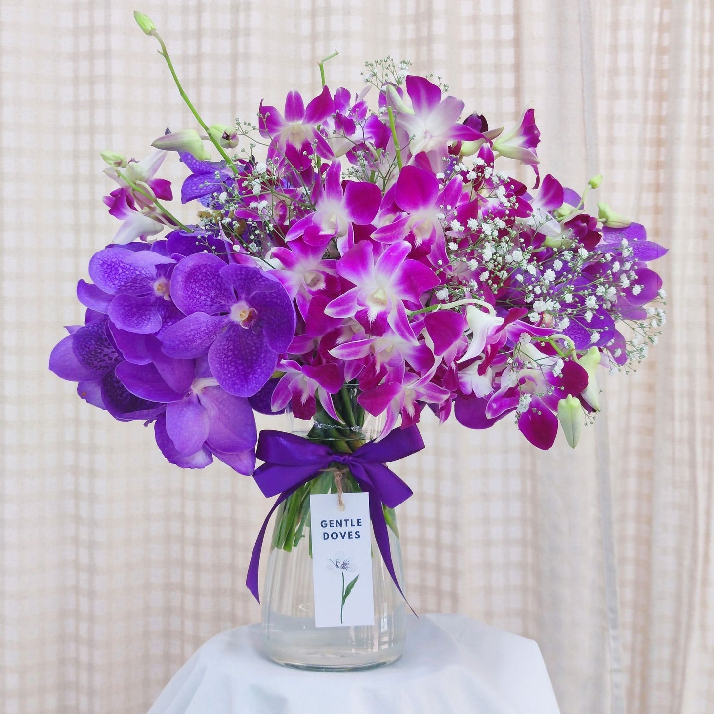 Purple Orchids Flowers in Large Vase Arrangement