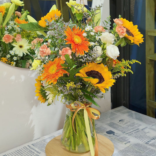 Assorted Warm Flowers in Extra Large Vase Arrangement