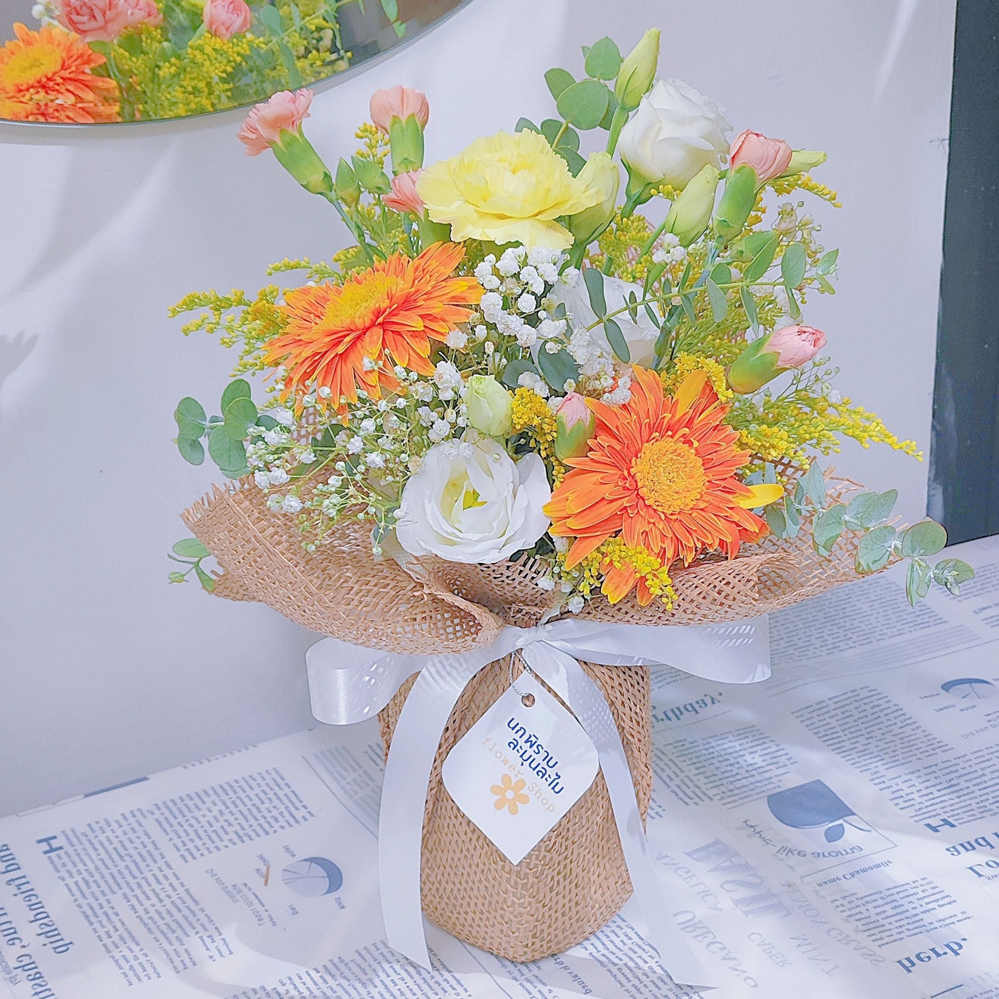 Assorted Warm Flowers with Foliage in Medium Size Vase Arrangement