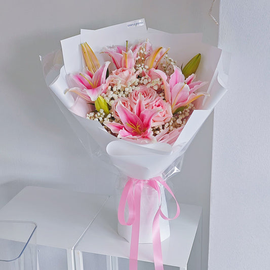 Pink Lilies and Soft Pink Roses with Gypsophila in White Paper Bouquet