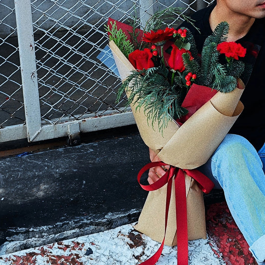 Assorted Christmas Pines and Conifers with Red Flowers Bouquet