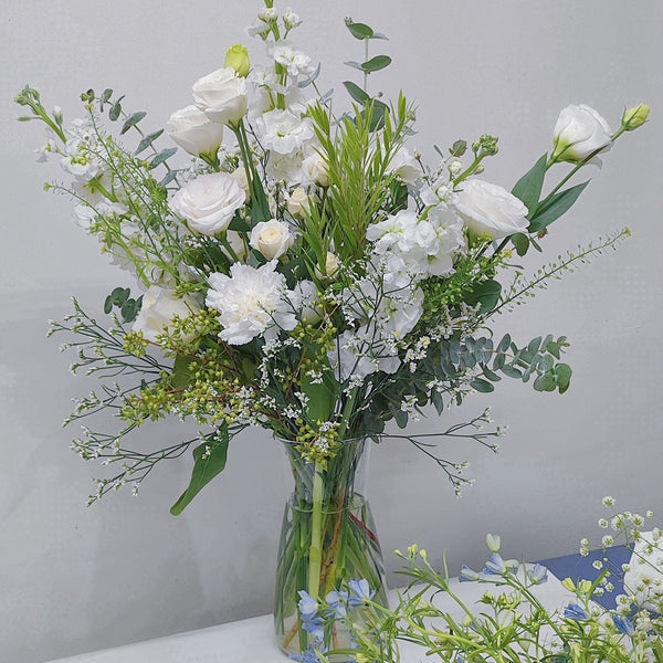 Assorted White Flowers and Green Foliage Natural Style in Large Vase Arrangement