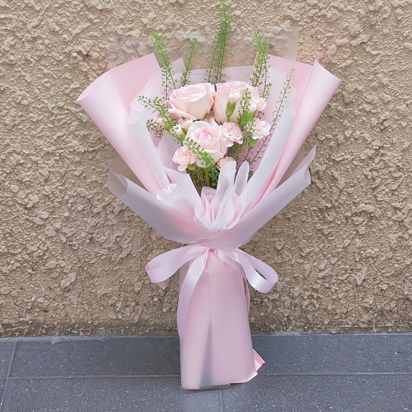 Three Soft Pink Roses with Sprayed Carnations Bouquet