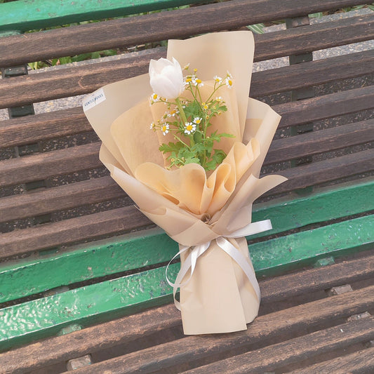 Single White Tulip with Daisies in Brown Paper Bouquet