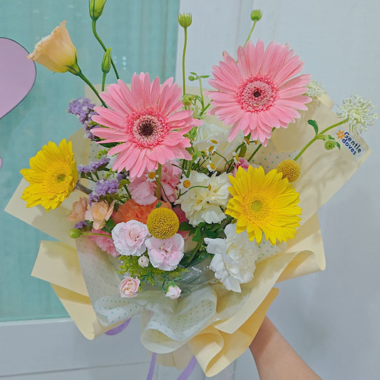 Assorted Pastel and Colorful Flowers in Soft Yellow Bouquet