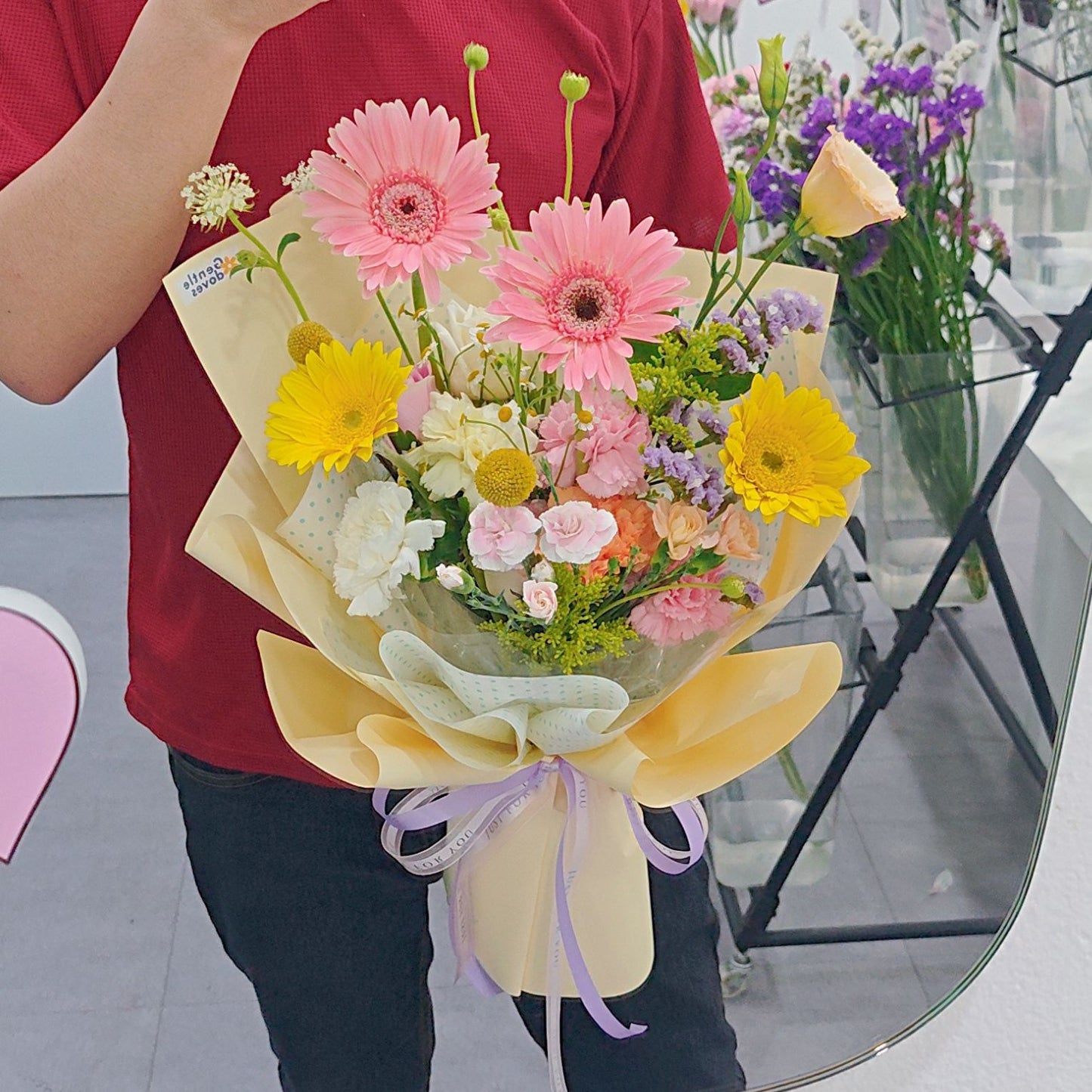 Assorted Pastel and Colorful Flowers in Soft Yellow Bouquet
