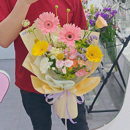 Assorted Pastel and Colorful Flowers in Soft Yellow Bouquet
