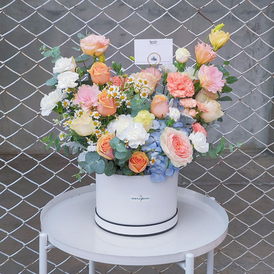 Assorted Orange Flowers in Medium Box Arrangement