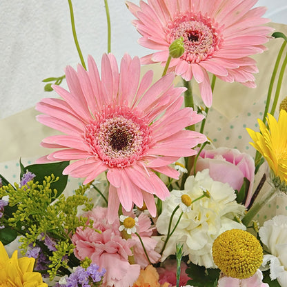 Assorted Pastel and Colorful Flowers in Soft Yellow Bouquet