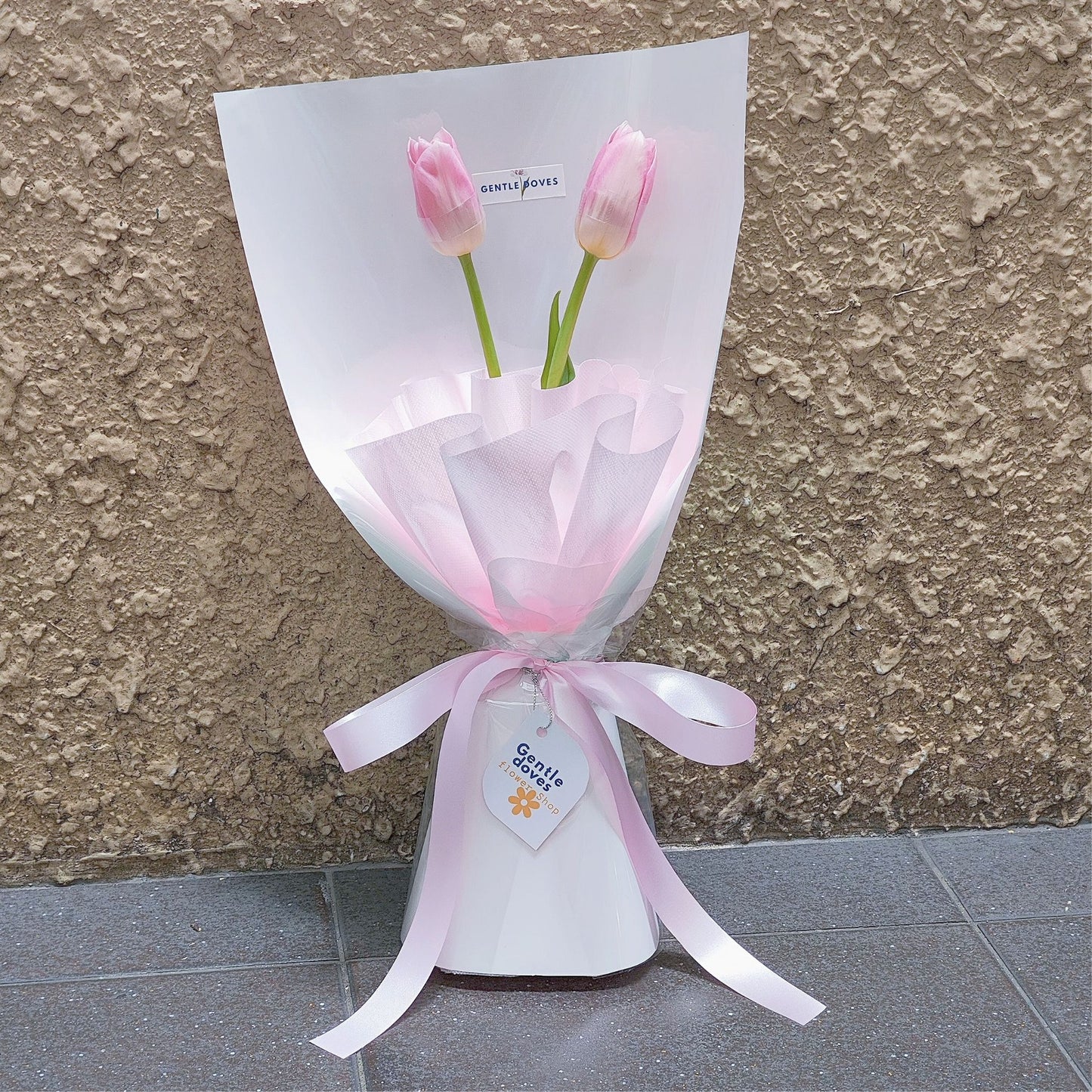 Two Soft Pink Tulips in White Paper Bouquet