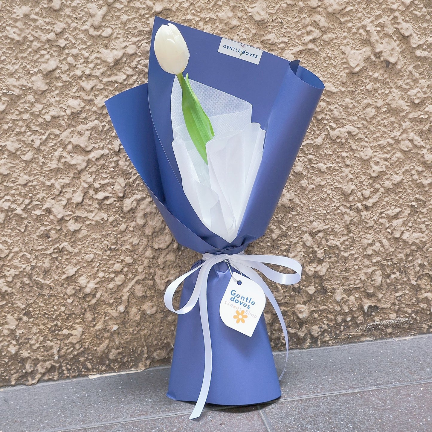 Single White Tulip in Blue Paper Bouquet