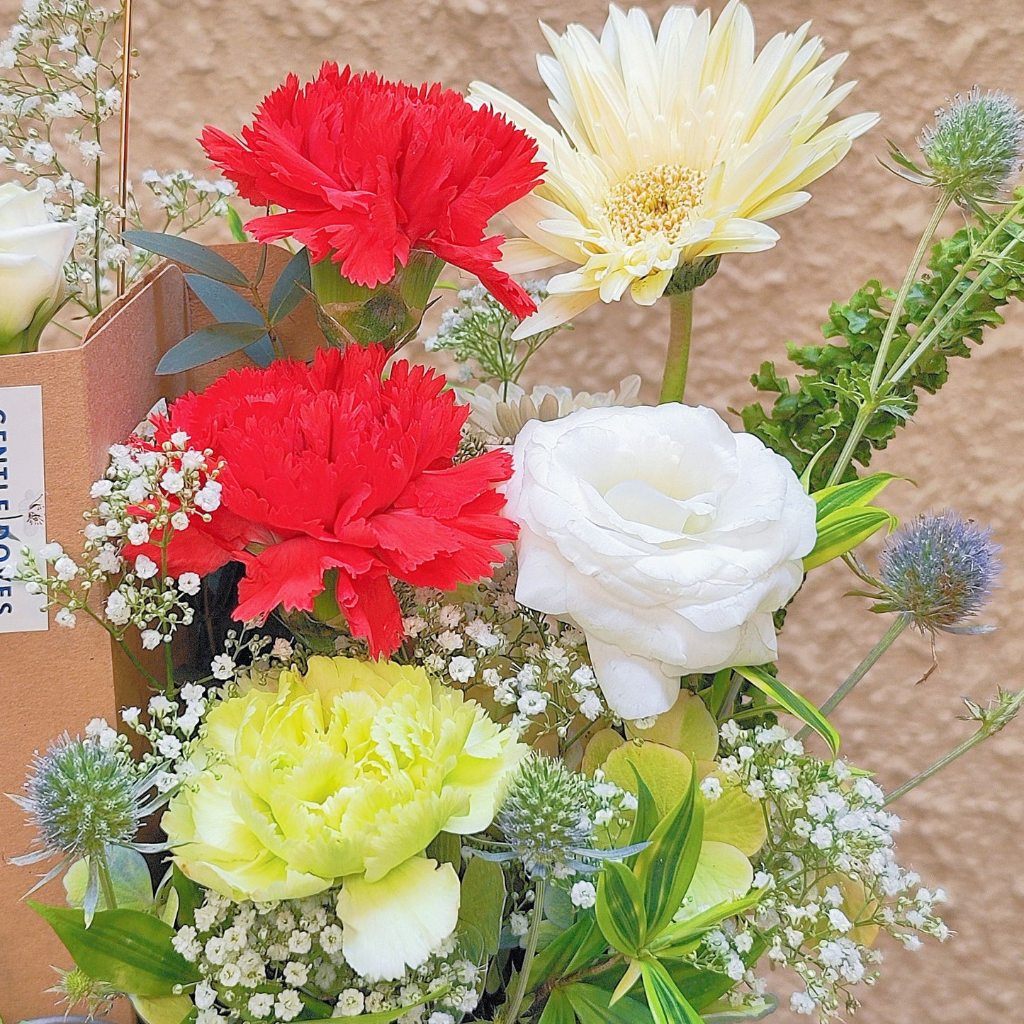 Assorted Red and Green Flowers in Carrying Small Box