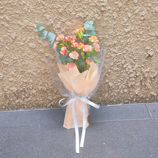 Assorted Orange Sprayed Carnations with Eucalyptus Bouquet