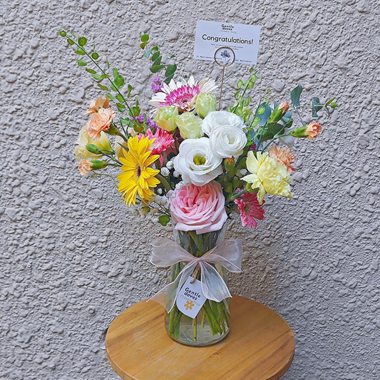 Assorted Colorful Flowers in Large Vase Arrangement