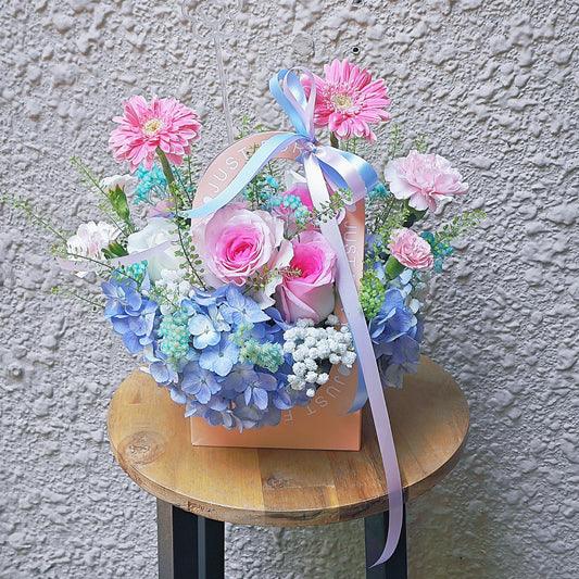 Assorted Pink and Blue Flowers in Carrying Mini Box Arrangement