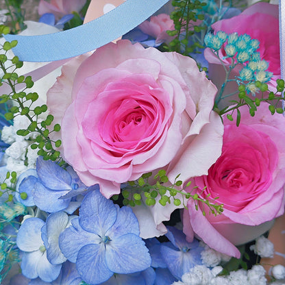 Assorted Pink and Blue Flowers in Carrying Mini Box Arrangement
