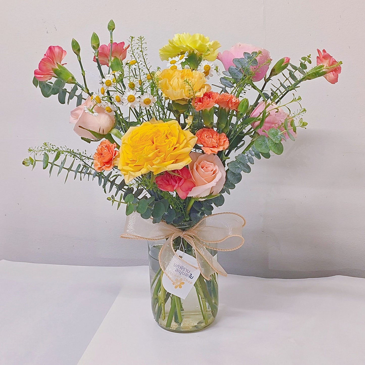 Assorted Orange and Yellow Flowers in Medium Vase Arrangement