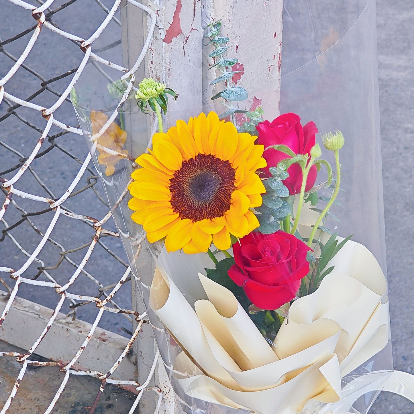 Single Sunflower with Two Red Roses and Green Foliage Minimal Small Bouquet