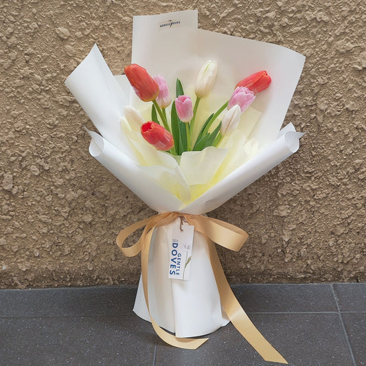 Nine Assorted Tulips in White Paper Bouquet