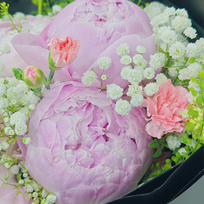 Five Soft Pink Peonies with Assorted Pink Flowers and Foliage in Black Paper Bouquet
