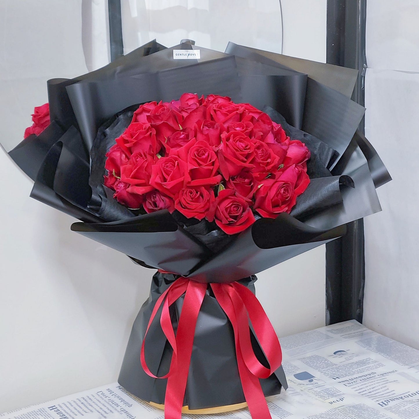 Forty Red Roses in Black Paper Bouquet