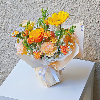 Assorted Yellow and Orange Flowers with Green Foliage Small Vase Arrangement