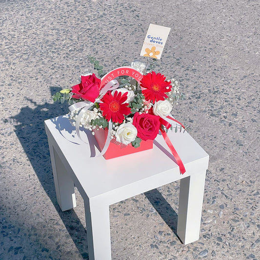 Assorted Red and White Flowers in Carrying Mini Box Arrangement